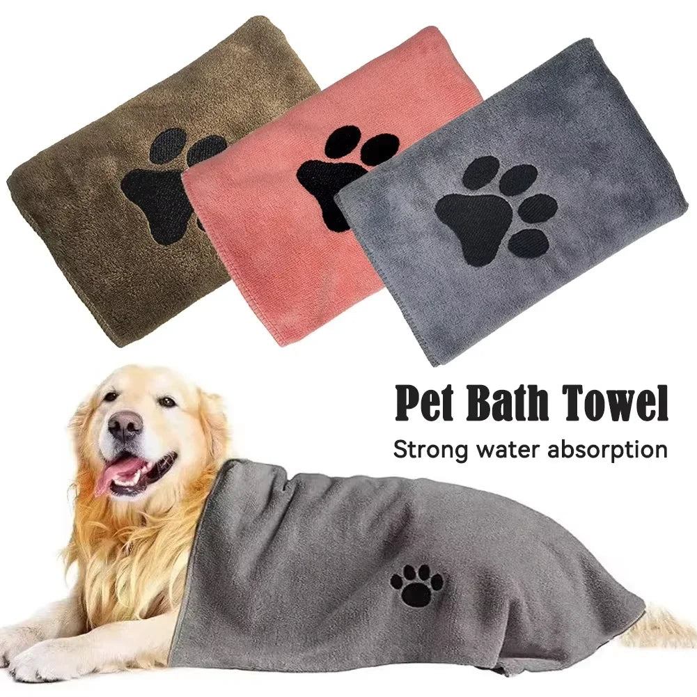 Khaki, pink and grey towels above a retriever lying under a grey towel